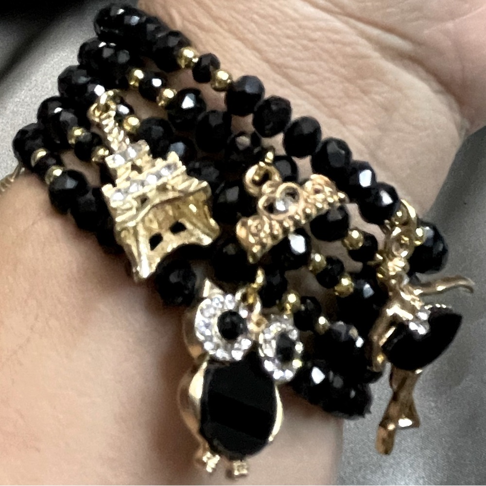 Wired crystals beaded bracelet, gold plated charms.